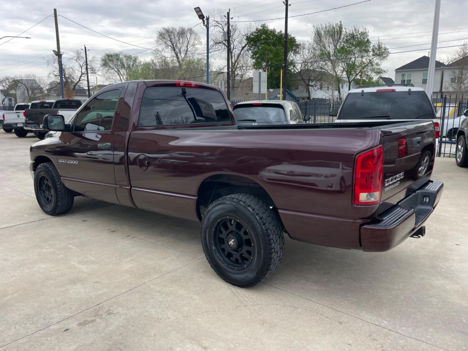 2004 Maroon /Black Dodge Ram 2500 Laramie 2WD (3D7KA26C44G) with an 5.9L L6 OHV 24V TURBO DIESEL engine, Automatic transmission, located at 1501 West 15th St., Houston, 77008, (713) 869-2925, 29.797941, -95.411789 - Photo #3
